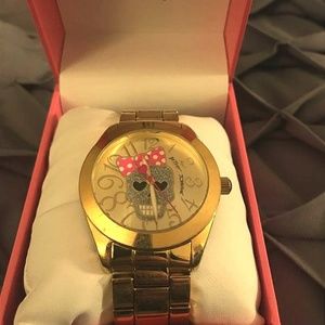 Betsy Johnson gold skull watch